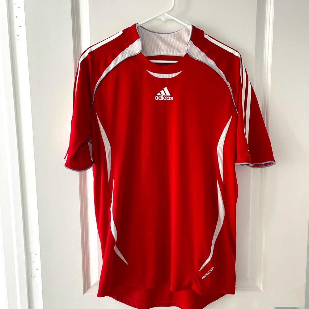 Adidas Men soccer play shirt.